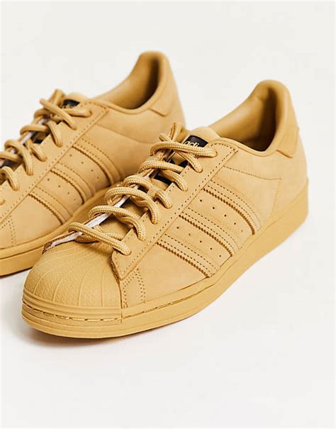 adidas Originals superstar sneakers in beige 